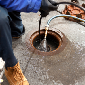 Plumber repairing leaky water flow